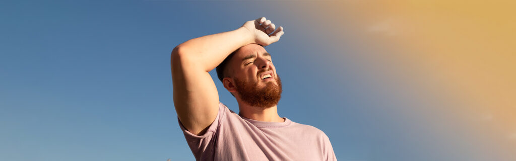 Man experiencing heat stroke symptoms